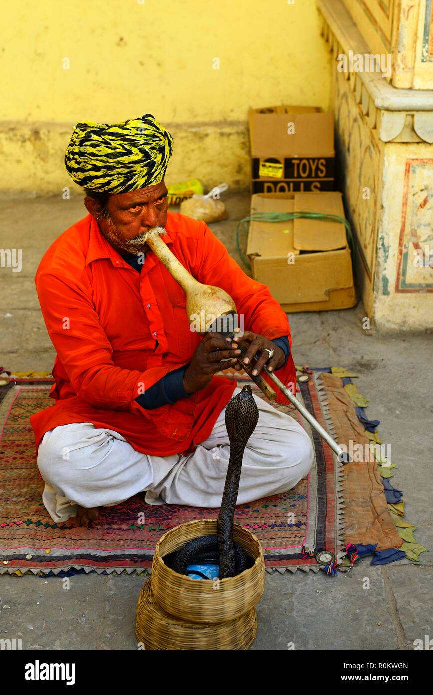 Snake charmer with cobra in the city palace, Jaipur, Rajasthan, India Stock Photo