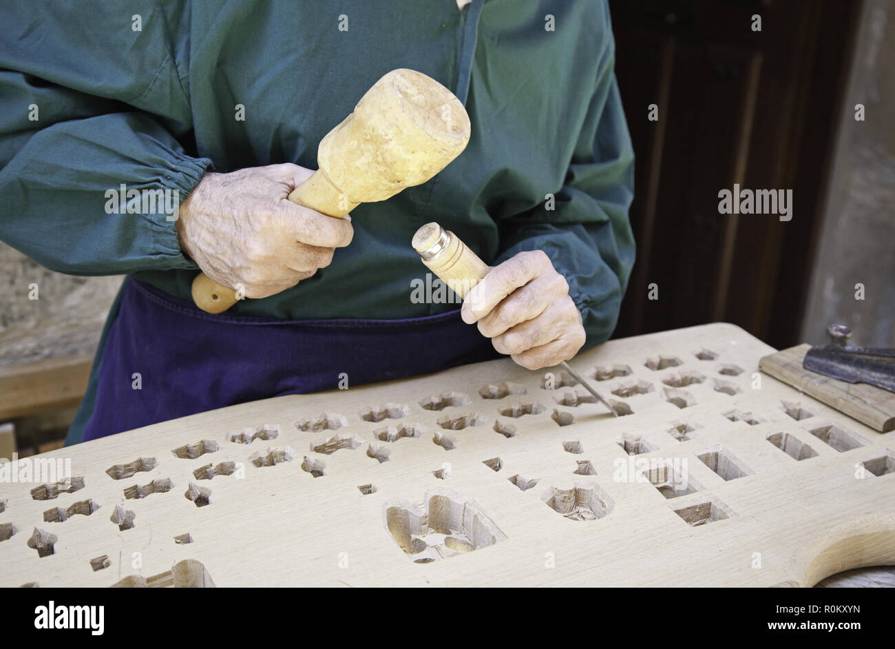 Woodworker with chisel, detail of a wood carving worker Stock Photo - Alamy