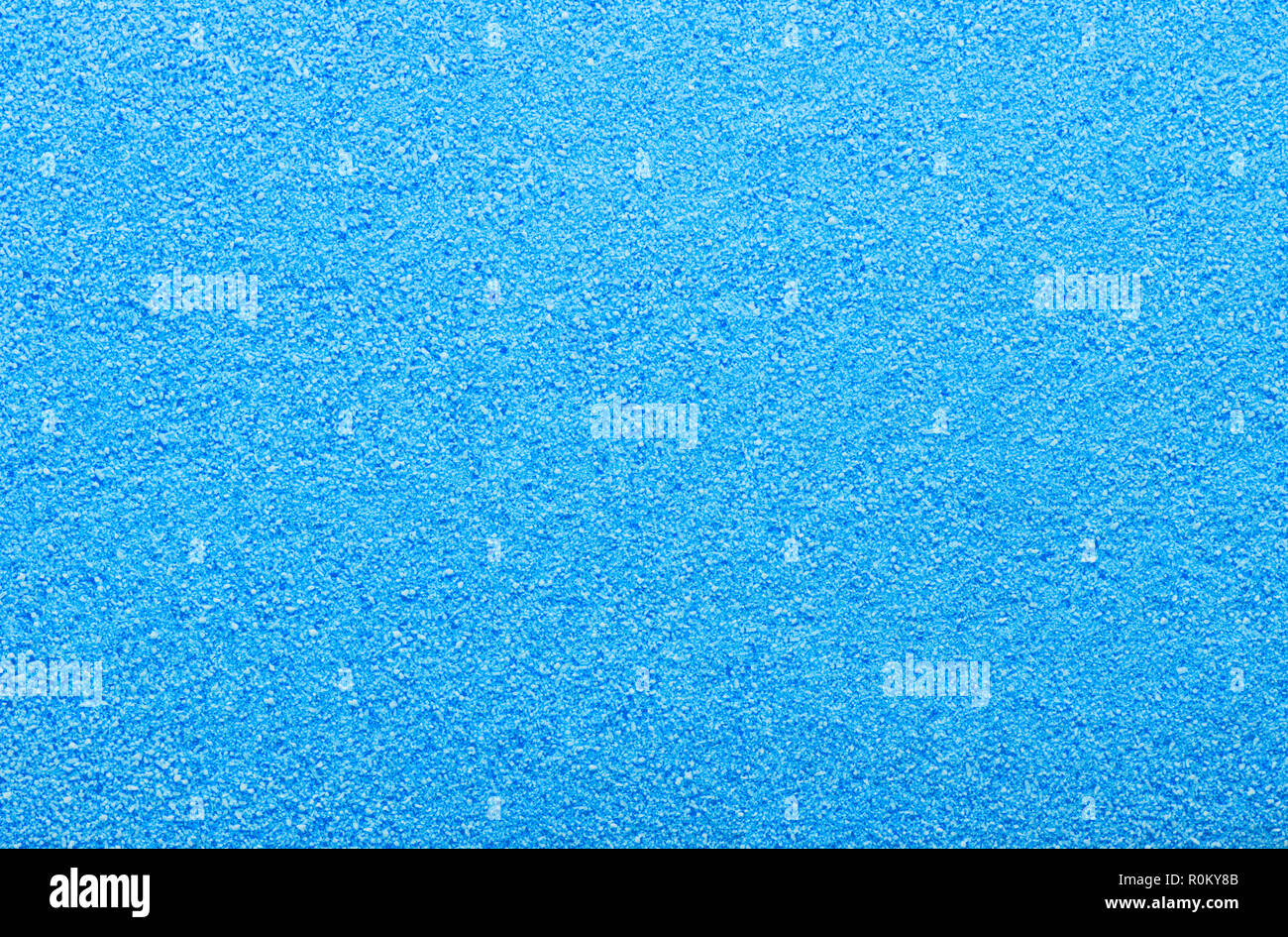 Flat Pile of Blue Sugar Grain Textured Background. Stock Photo