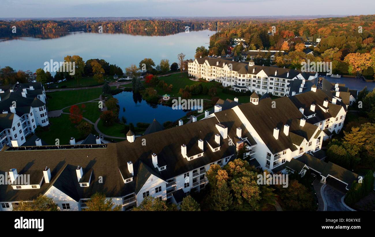 Aerial vista at sunrise over Elkhart Lake, The Osthoff Resort's reflecting pond during colorful autumn, Elkhart Lake, Wisconsin, USA. Stock Photo