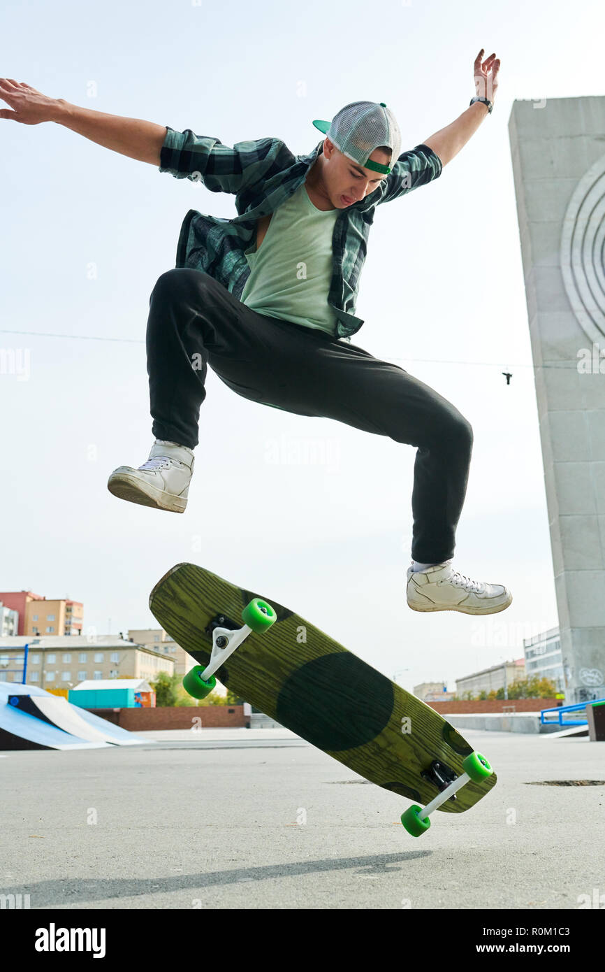 Young Man doing Skating Stunts Stock Photo - Alamy