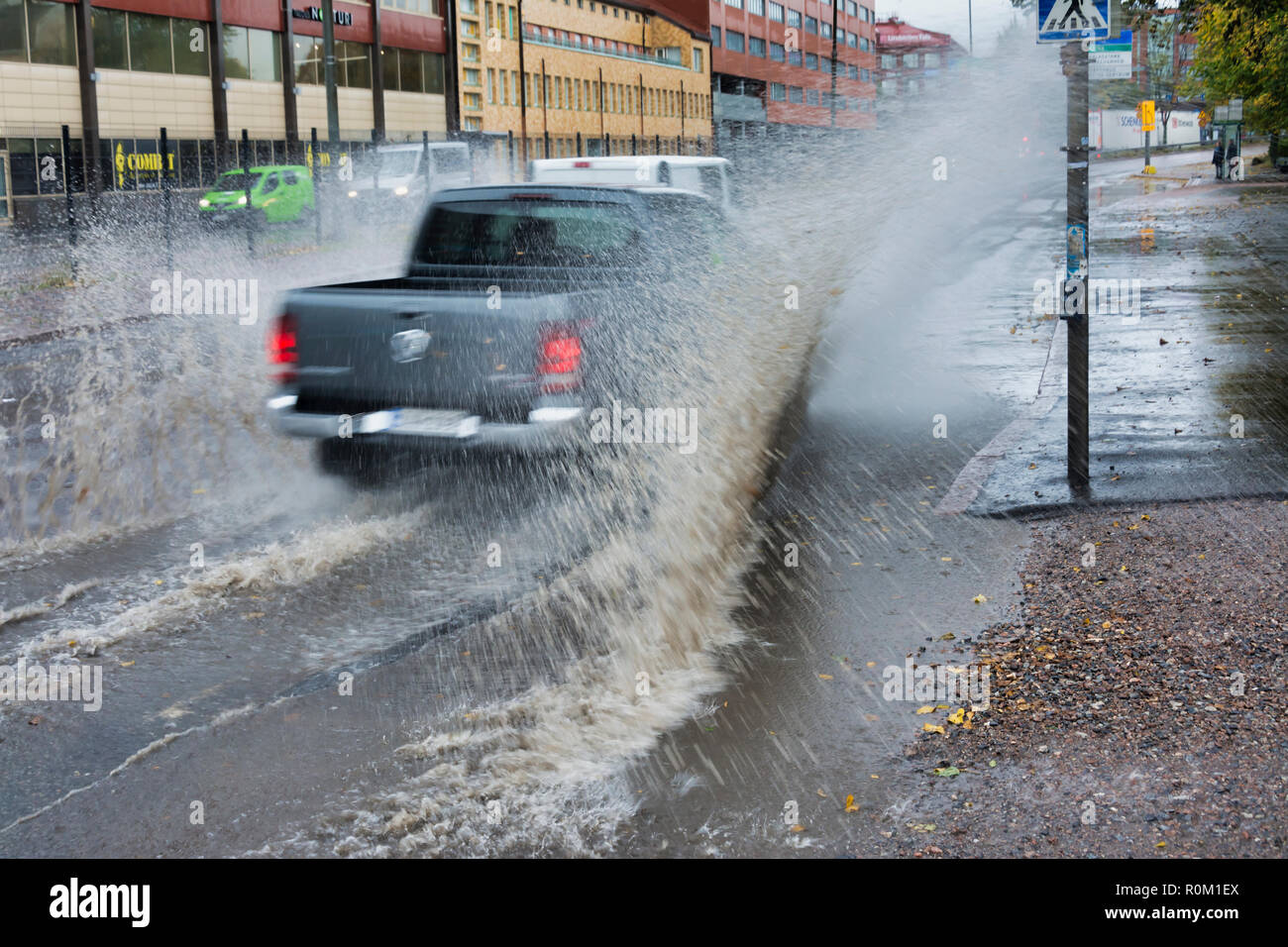 Car splashes water in Helsinki Finland Stock Photo Alamy