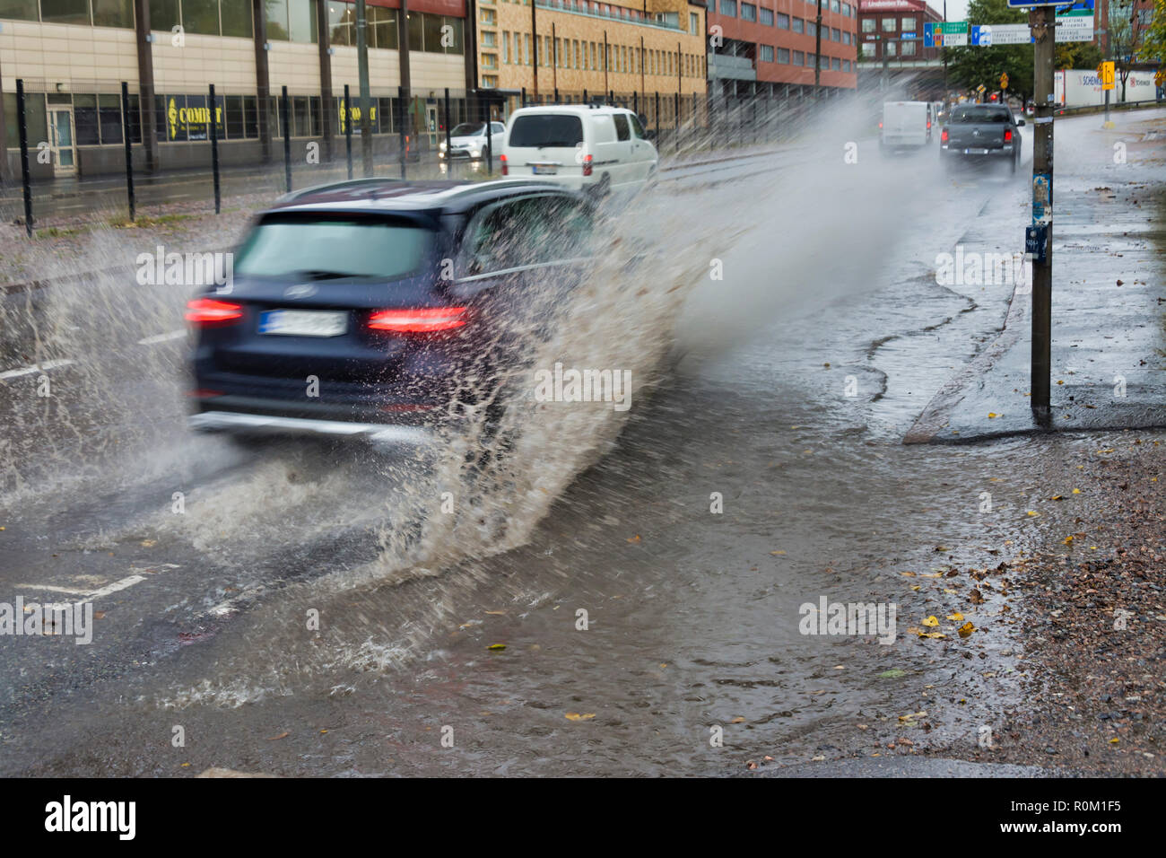 Car splashes water in Helsinki Finland Stock Photo Alamy