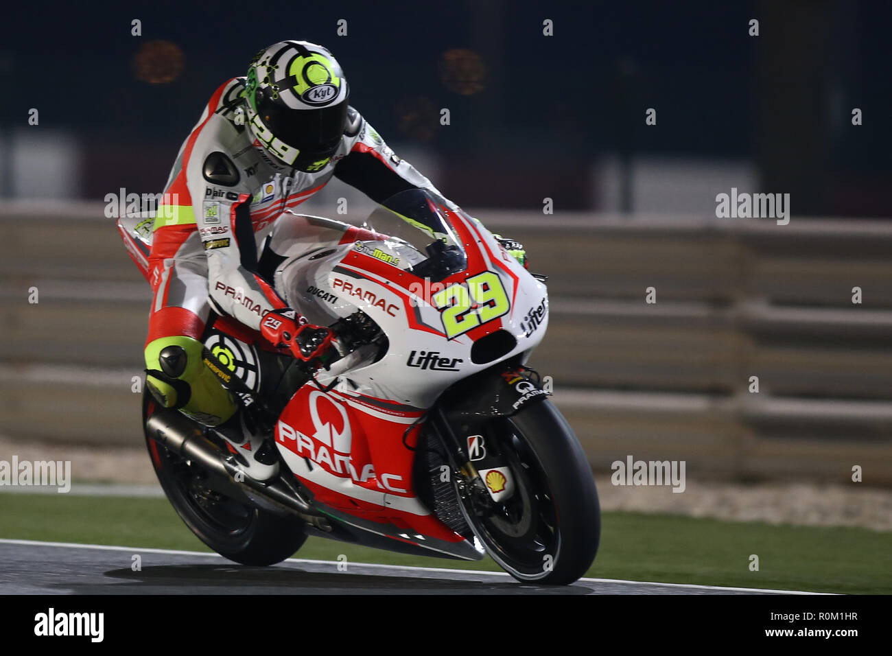 Andrea Iannone of Italy and Suzuki Ecstar team steers his bike during a final session of the Moto GP World Championship at the Losail International Circuit. Stock Photo