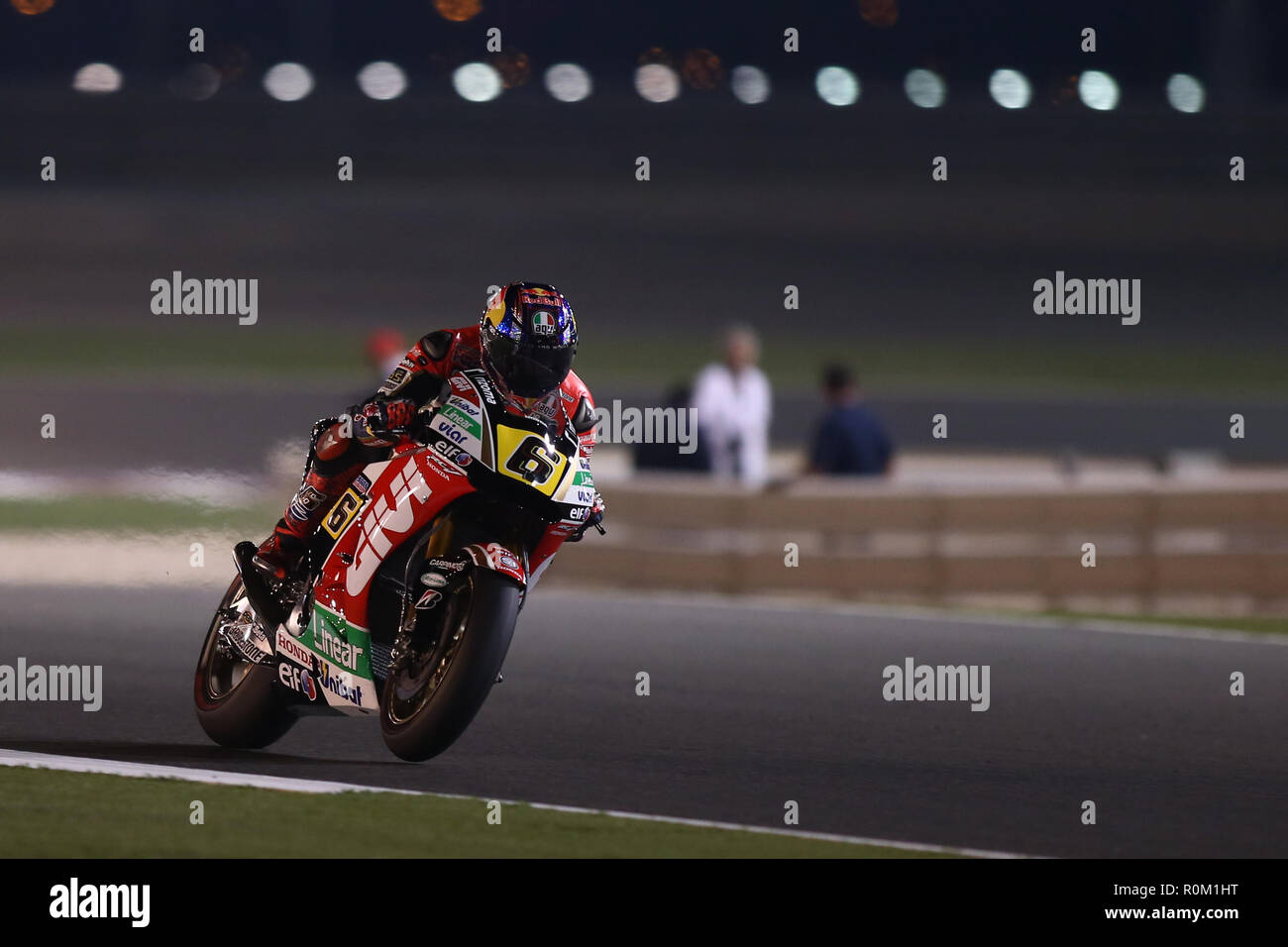 Stefan Bradl of Germany and LCR Honda MotoGP team steers his bike during a final session of the Moto GP World Championship at the Losail International Circuit. Stock Photo