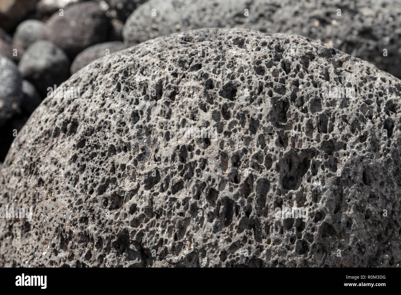 Volcanic pumice rocks on the Atlantic shore of Tenerife at Amarilla in the Canary Islands Stock Photo