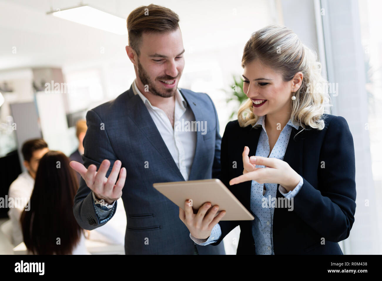 Young attractive architects using digital tablet in office Stock Photo