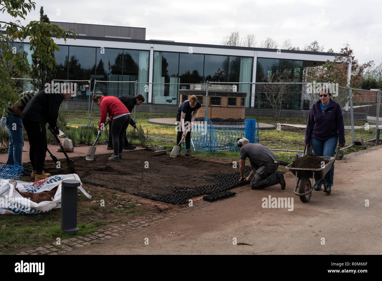 Young volunteers working on a new war site for the Phantom memorial at the National Memorial Arboretum, Britain's year-round national site of remembra Stock Photo