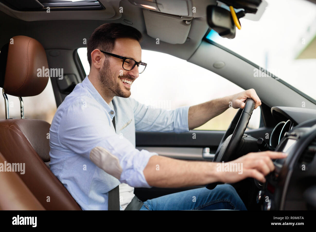 Man Using Gps Navigation System In Car to travel Stock Photo