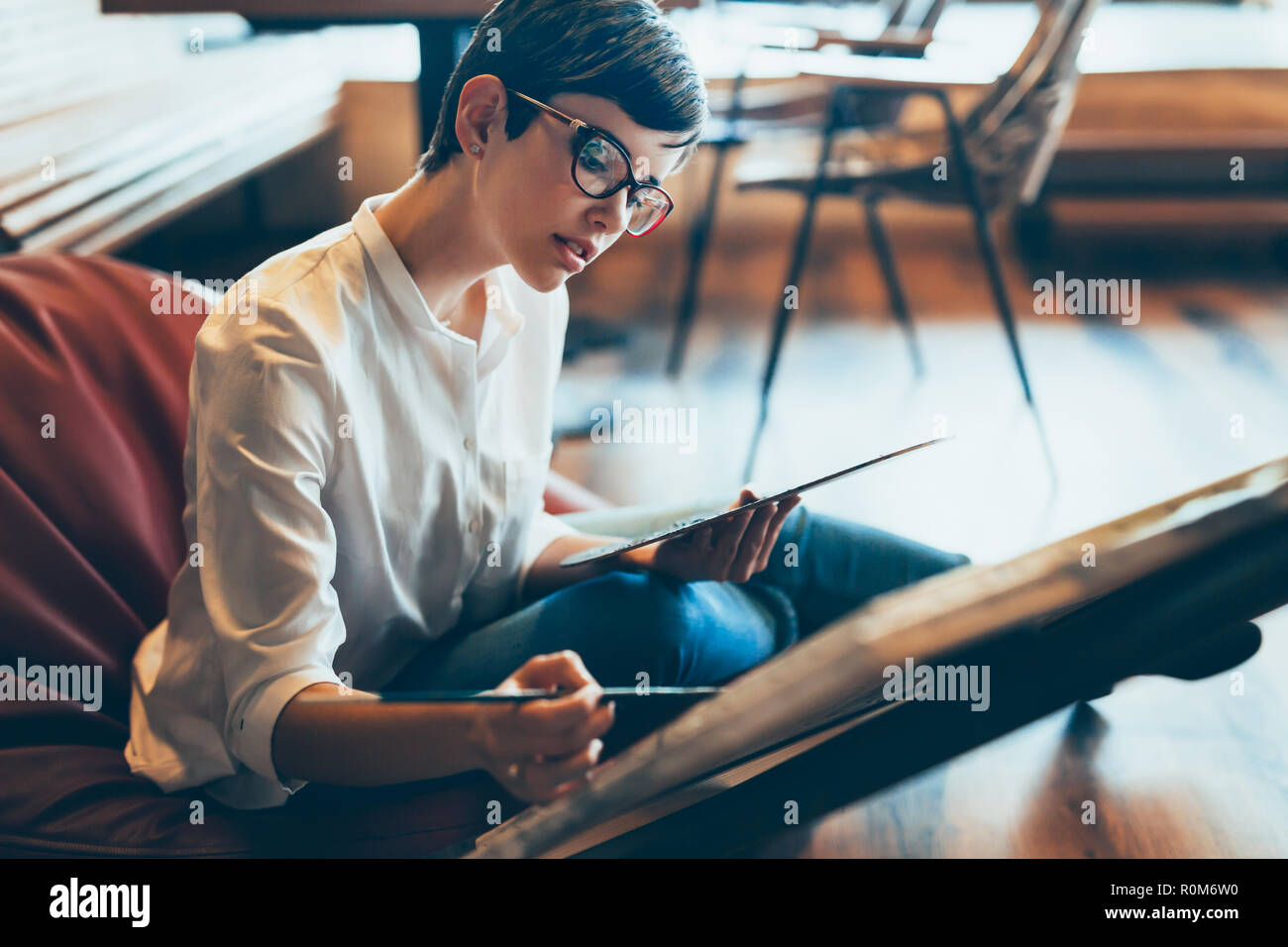 Female artist painting with palette and paintbrush Stock Photo - Alamy