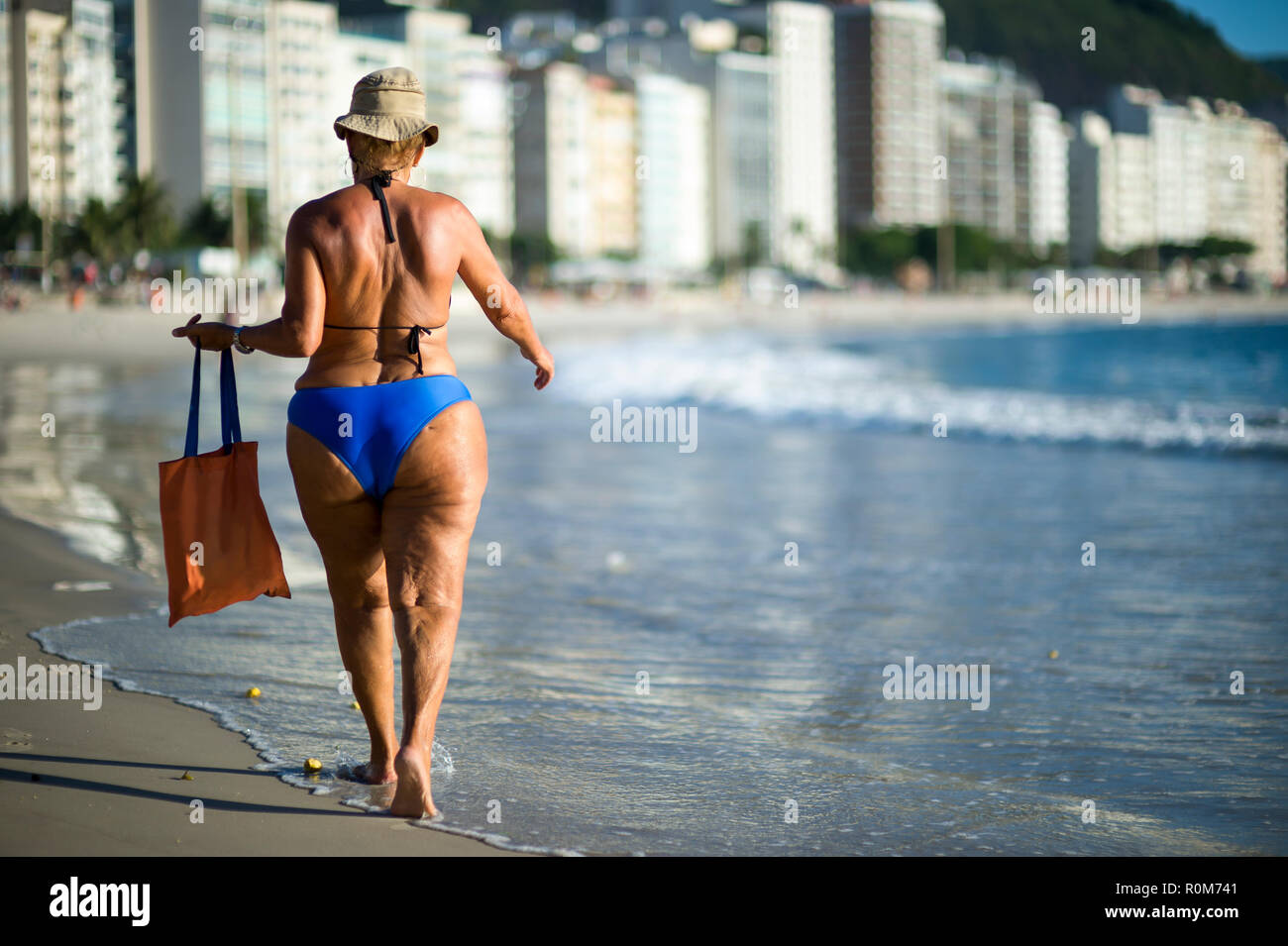 Bright Scenic Morning View Of Copacabana Beach With Woman Walking Along The Shore In Rio De Janeiro Brazil Stock Photo Alamy