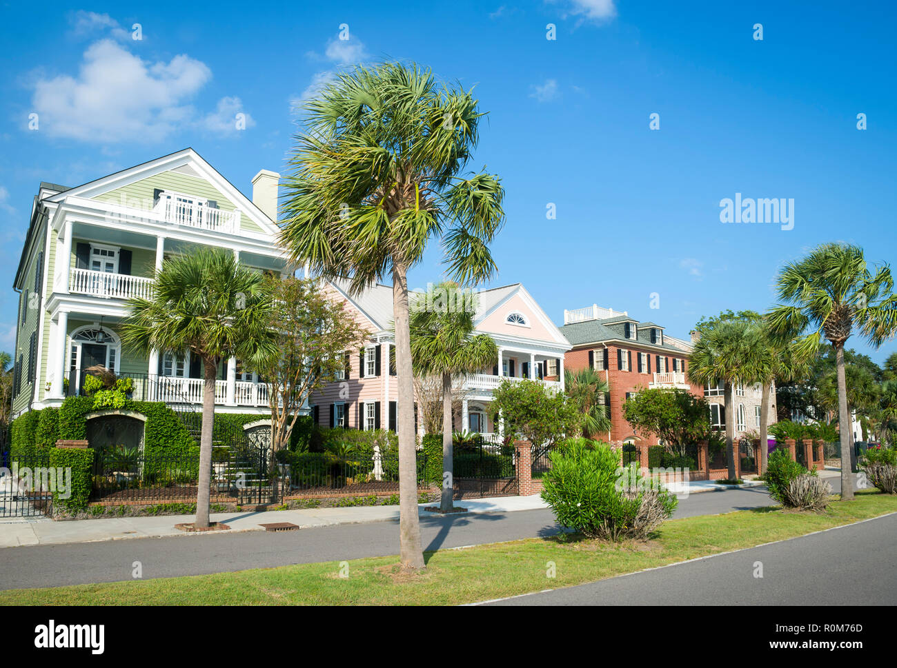 Bright scenic morning view of the historic Battery neighborhood with palmetto palm trees in