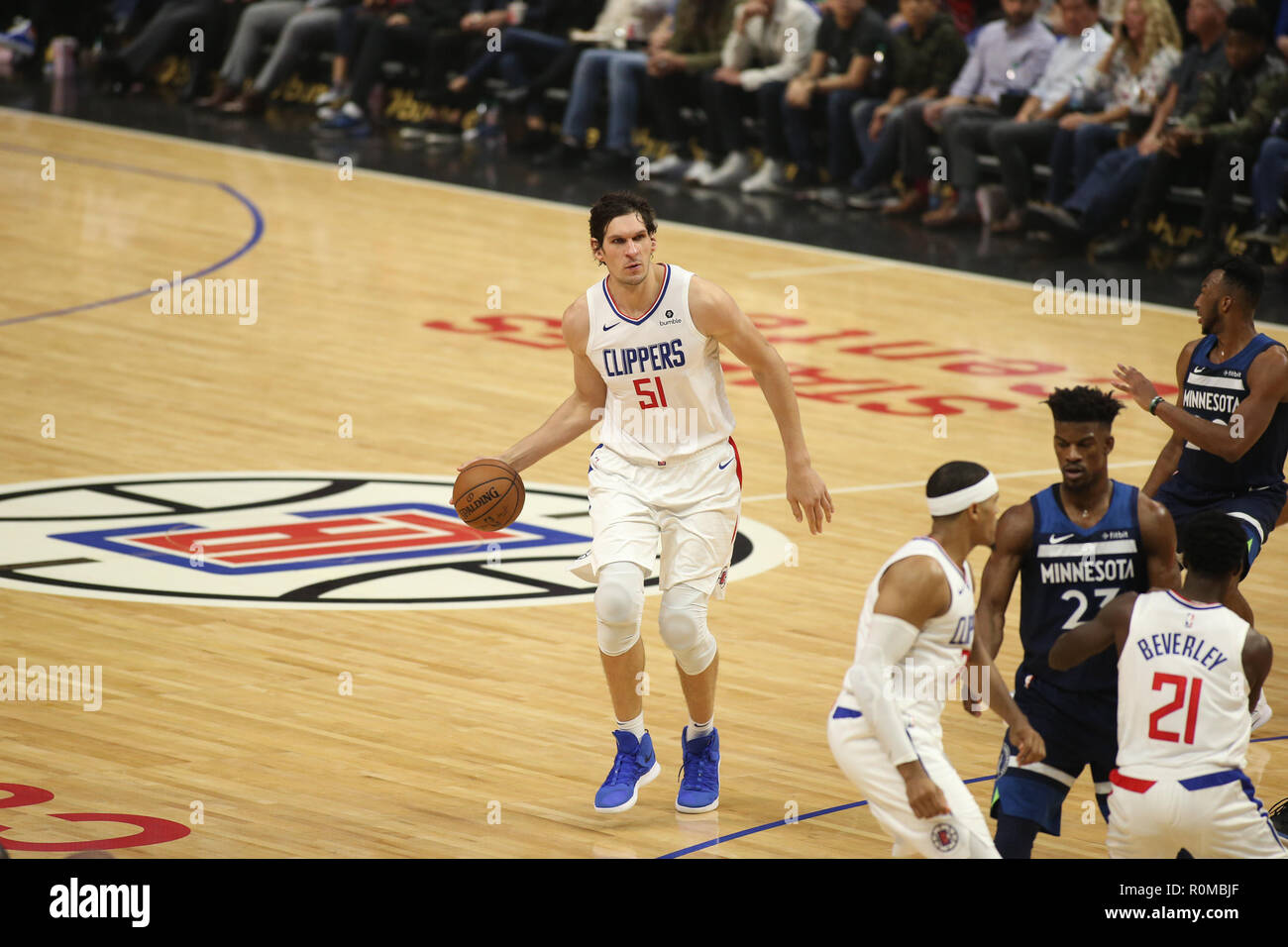 Los Angeles, California, USA. 16th Jan, 2019. Los Angeles Clippers' Boban Marjanovic (51) is defended by Utah Jazz's Rudy Gobert (27) during an NBA basketball game between Los Angeles Clippers and Utah