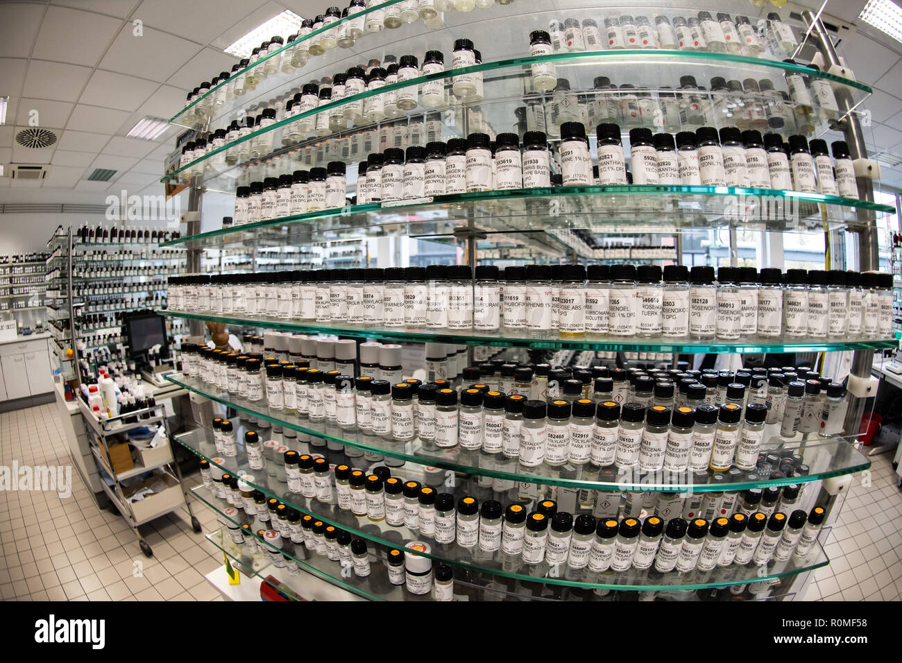 Holzminden, Germany. 23rd Oct, 2018. Various aromas in bottles from Symrise AG are on a shelf. Symrise AG is one of the world's leading suppliers of fragrances and flavors. Credit: Swen Pförtner/dpa/Alamy Live News Stock Photo