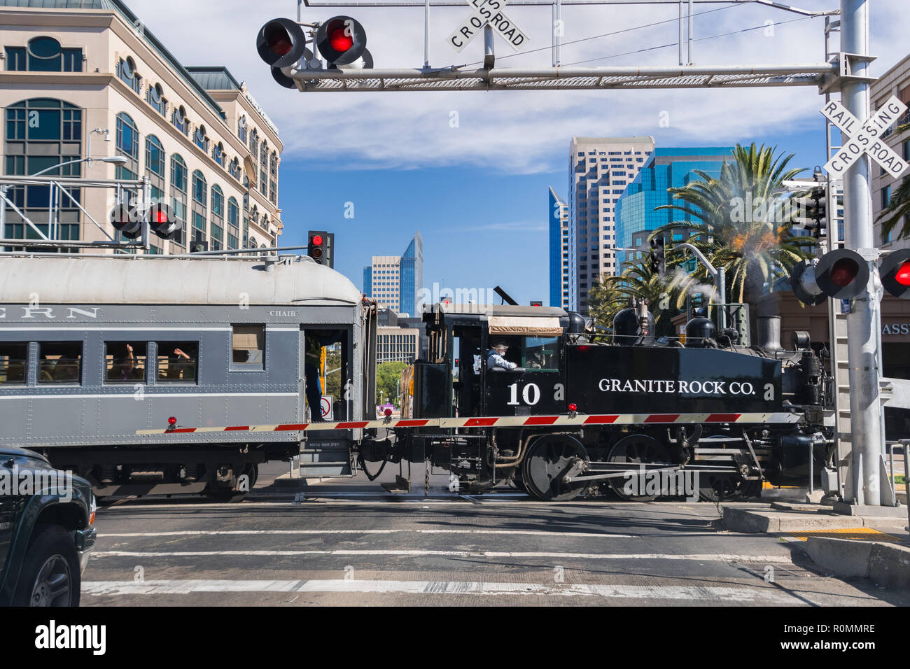 September 22, 2018 Sacramento / CA / USA - The  Granite Rock steam engine locomotive pulling cars full of tourists in downtown Sacramento; Stock Photo
