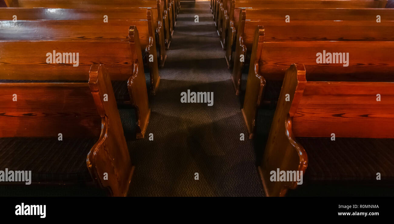 Close up view of pews inside an empty church Stock Photo