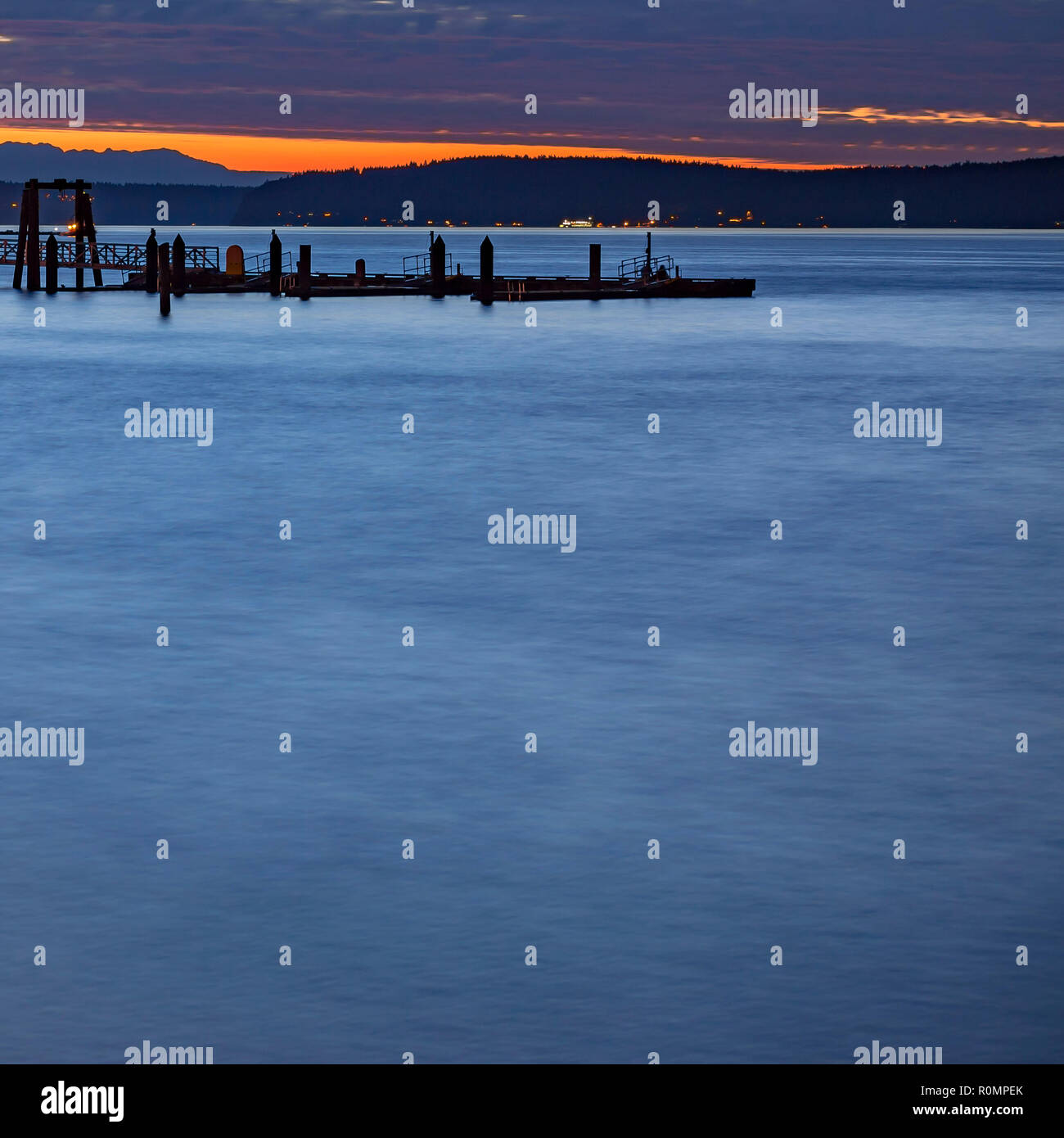 Mountain and pier at sunset in Washington Stock Photo Alamy