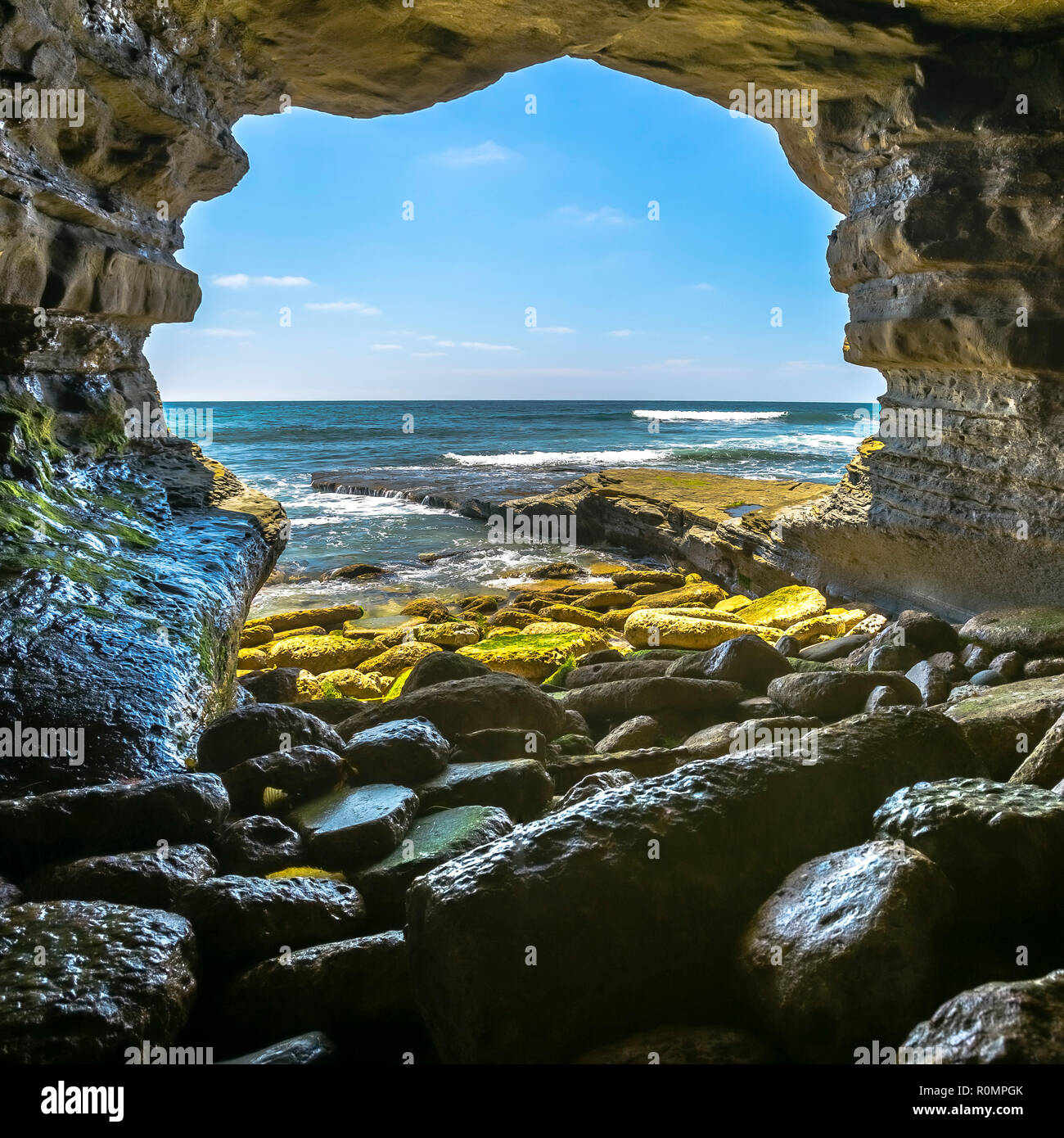 Ocean view form inside a rock cave in La Jolla Stock Photo