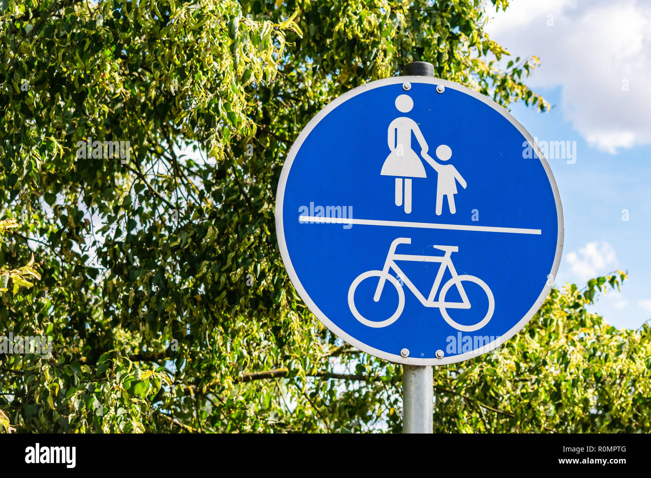 Cyclists and pedestrians blue road sign hi-res stock photography and ...