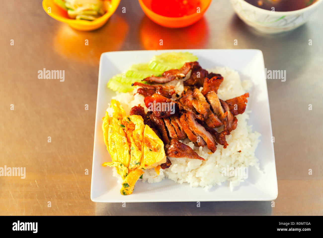 Traditional Asian food Thailand, Cambodia, Bali, Vietnam, Laos food: Fresh scrambled eggs with rice with barbecued meat Stock Photo