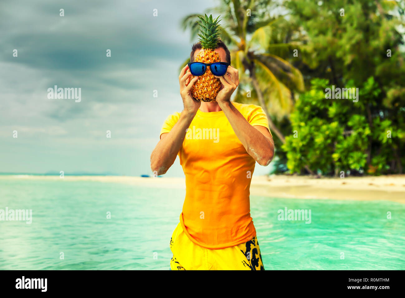 Funny traveler man have fun and enjoy summer vacation on tropical beach, play with friends, pineapple instead head on background nature landscape Stock Photo - Alamy Funny traveler man have fun and enjoy summer vacation on tropical beach, play with friends, pineapple instead head on background nature landscape Stock Photo - Alamy
