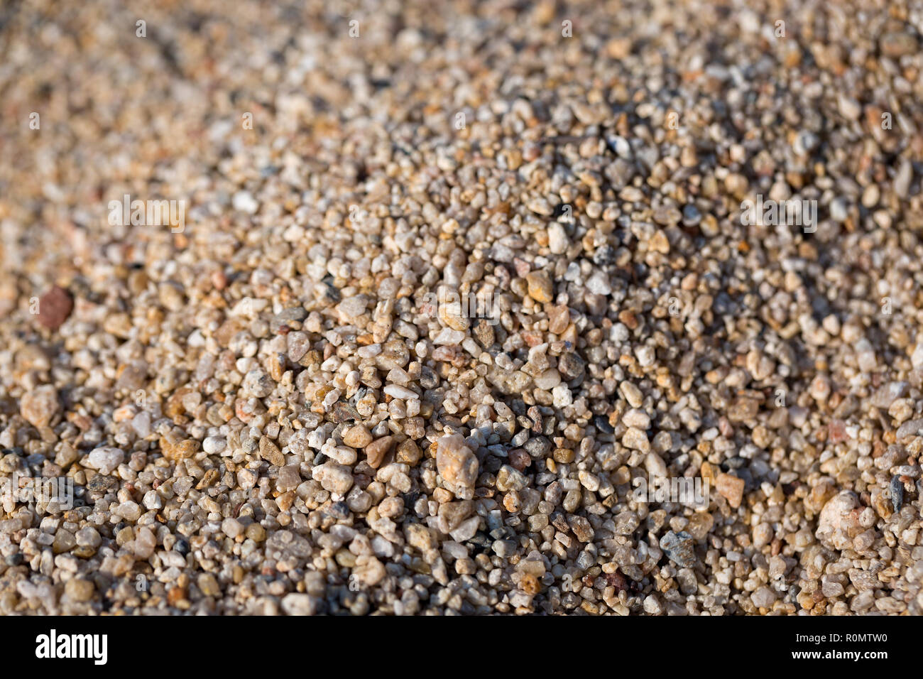 Closeup of sand on the beach. Crystals of sea sand as background. Macro shot Stock Photo