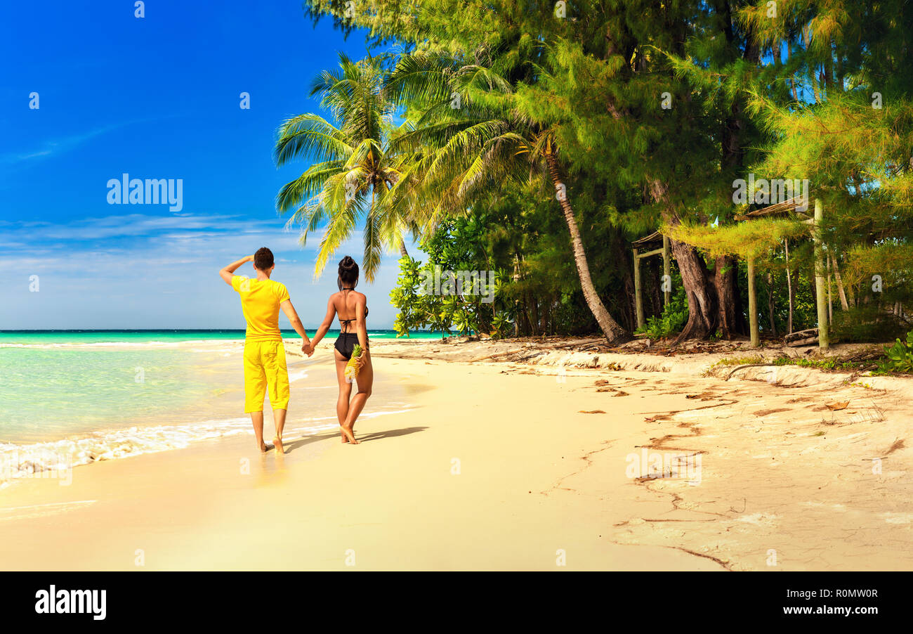 A Loving Couple Enjoy Honeymoon Vacation On Tropical Sandy Beach