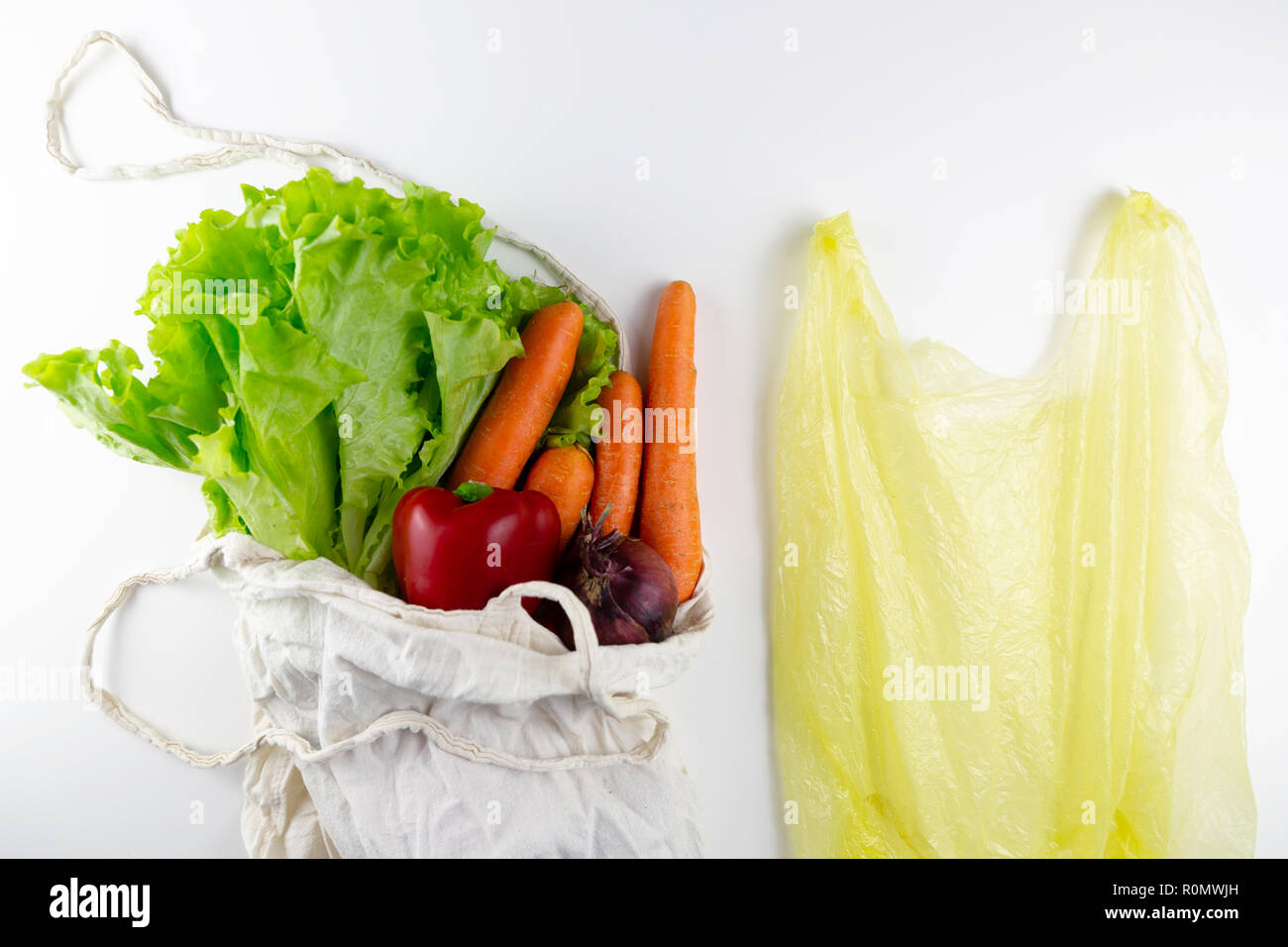 Zero waste concept. Vegetables in a woven bag. Woven bag vs plastic