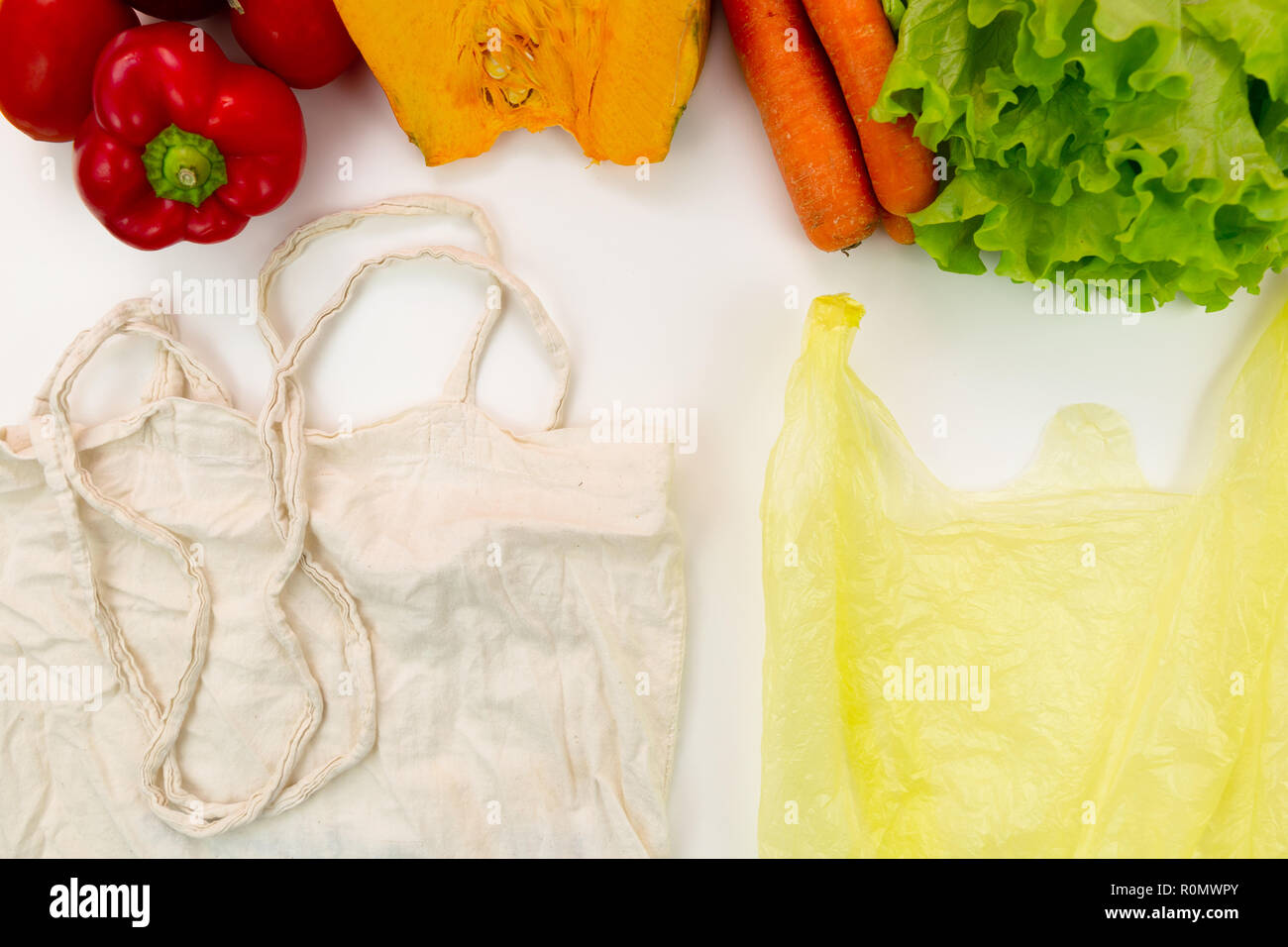 Zero waste concept. Woven bag vs plastic bags Stock Photo Alamy