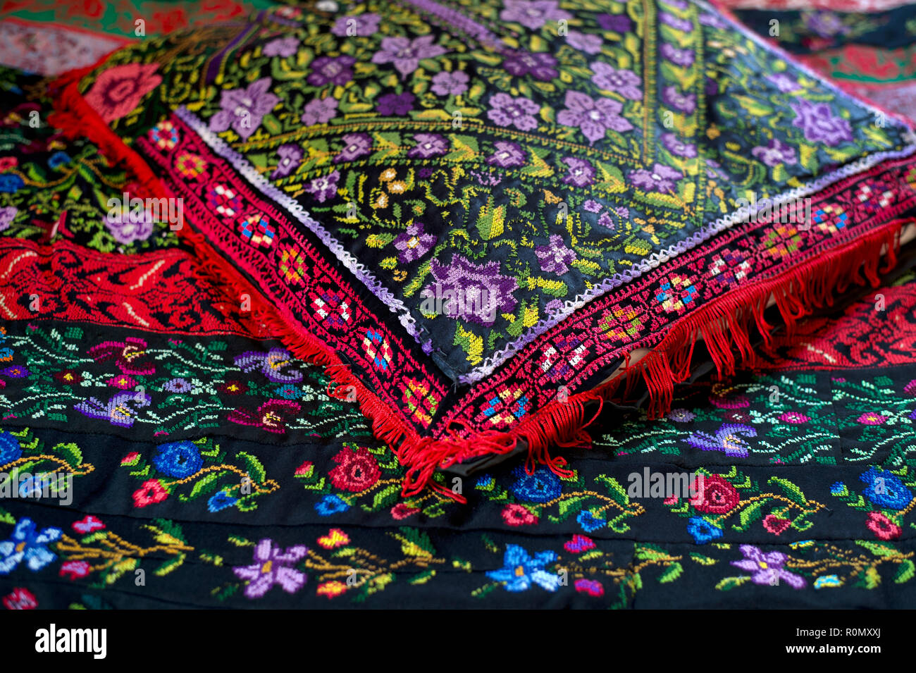 Jerusalem. Traditional Palestinian embroidery on bedspread and cushion. Stock Photo