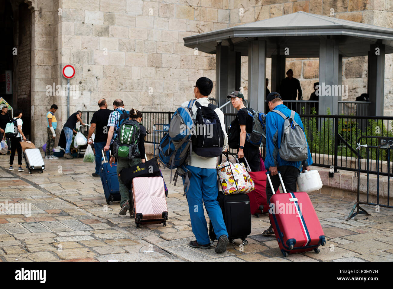Jerusalem. Damascus Gate, Old City. Tourists with wheelie suitcases. Stock Photo