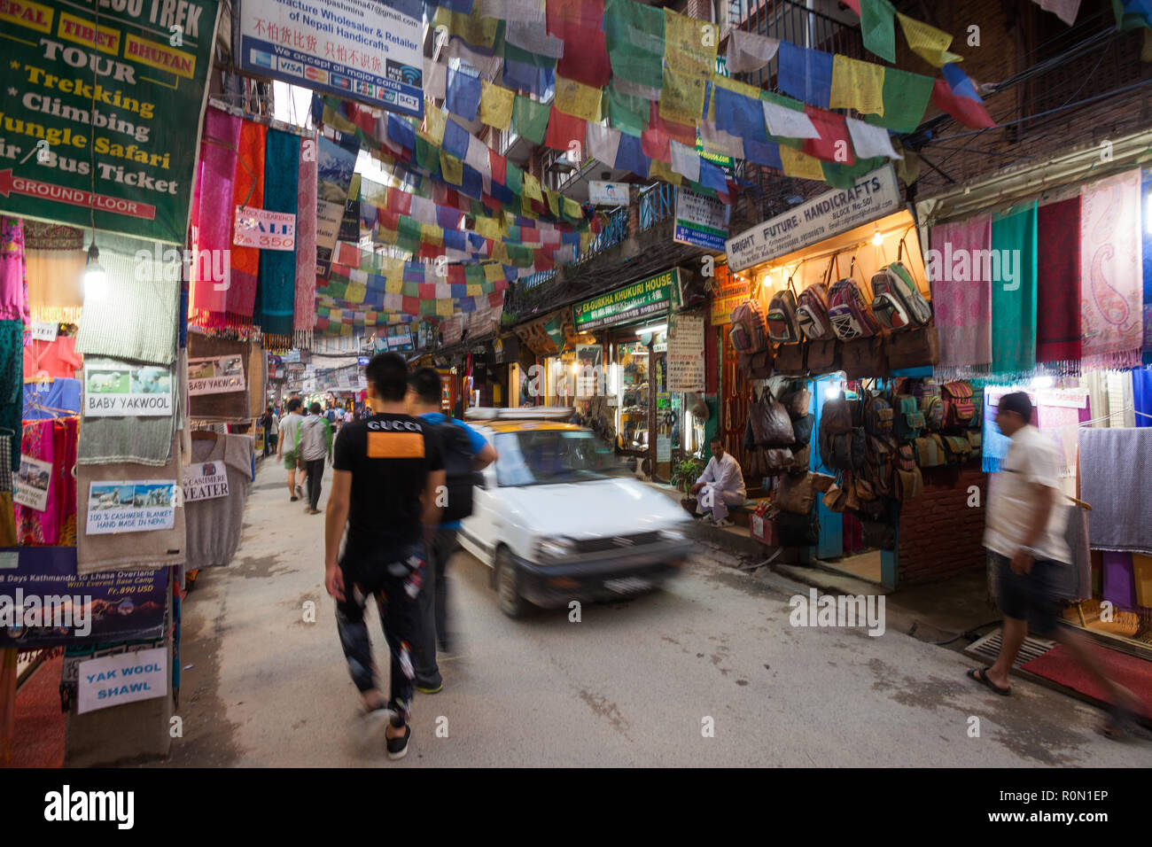 Passerby and vehicles in the narrow streets of Kathmandu's Thamel district, Nepal Stock Photo
