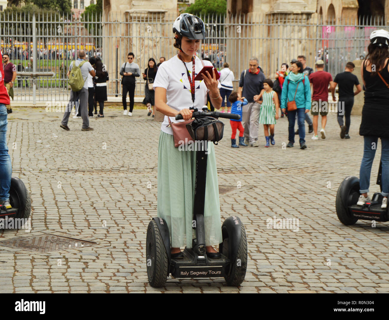 Rome, Italy-October 07, 2018, girl guide Segway City tour on Segway near Colosseum Stock Photo
