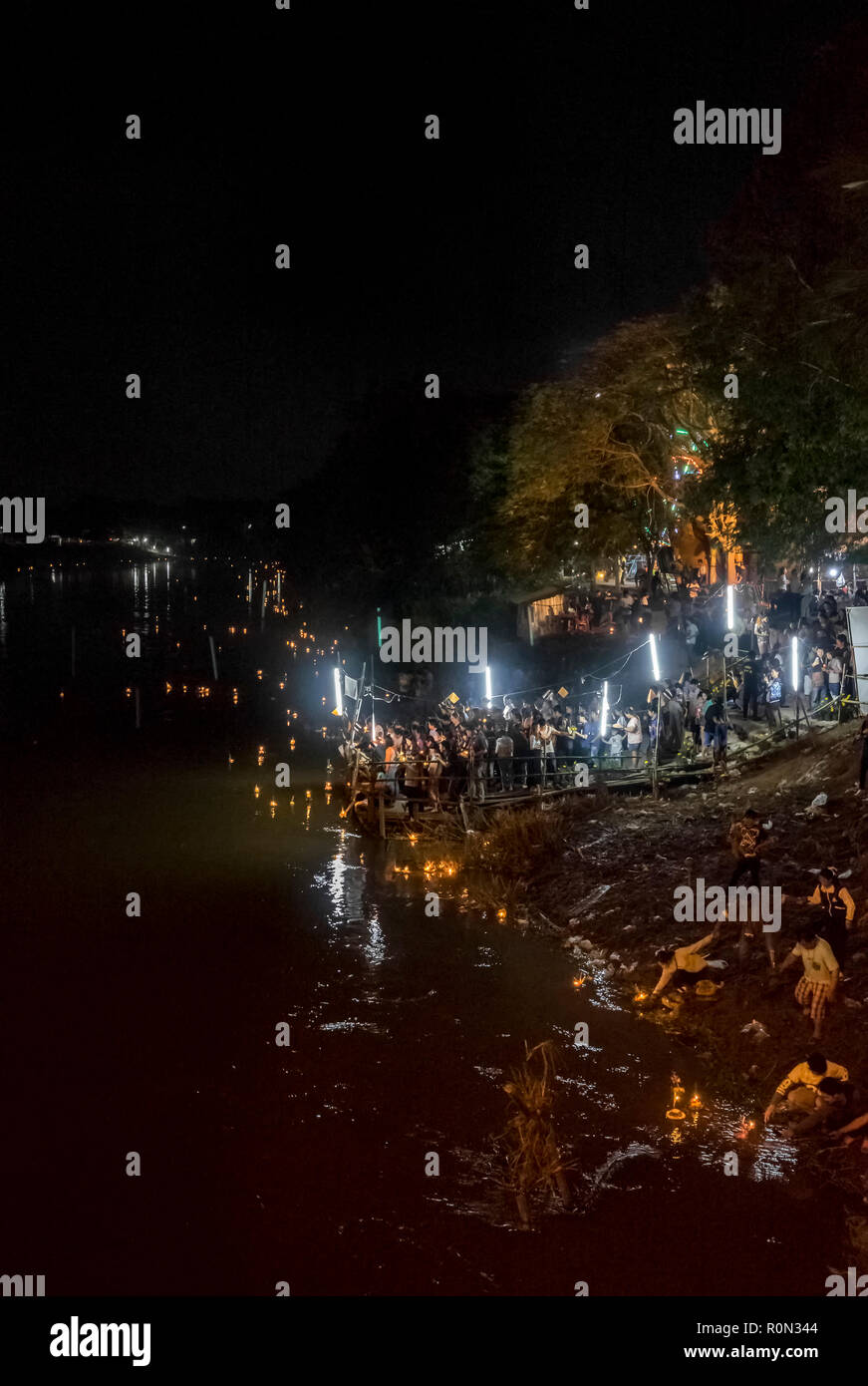 Thai people lauching lantern into the river for Loy Krathong Stock Photo