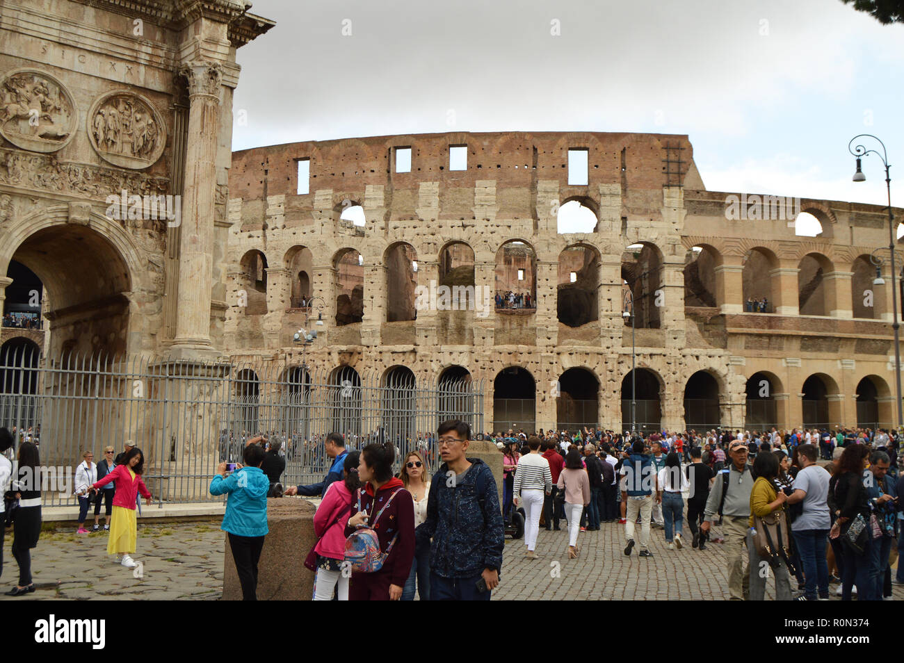 Multinational crowd of tourists in front of the Roman Colosseum, Rome, Italy October 7, 2018 Stock Photo