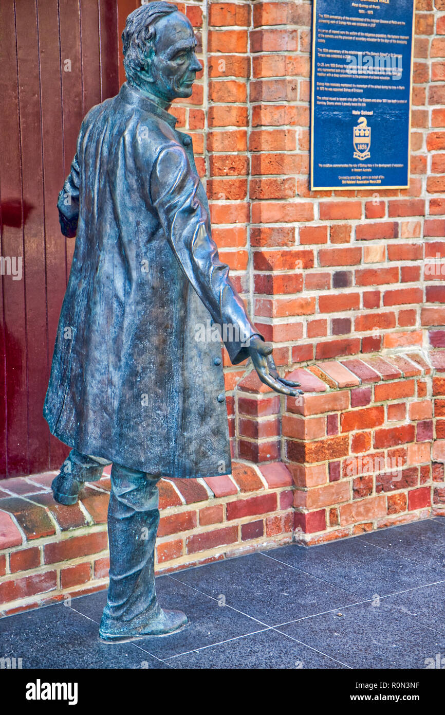 Realistic sculpture of man leaving building Stock Photo
