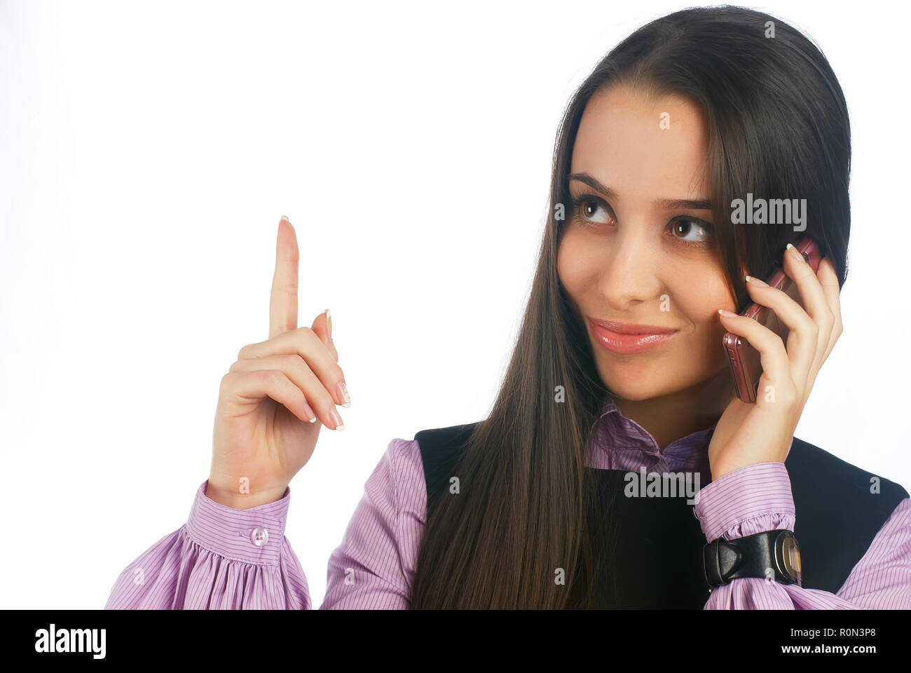 Fashionable young woman answering phone smiling and having idea. Isolated over white background Stock Photo
