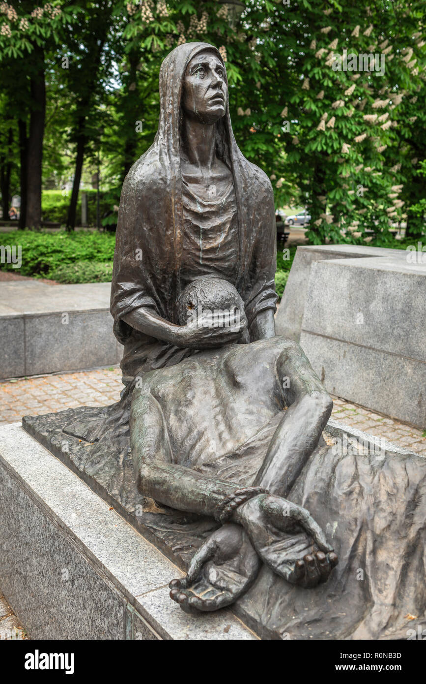 War memorial Poland, sculpture of a grieving Polish woman forming part of the Monument To Victims Of The Katyn Massacre in a park in Wroclaw, Poland. Stock Photo
