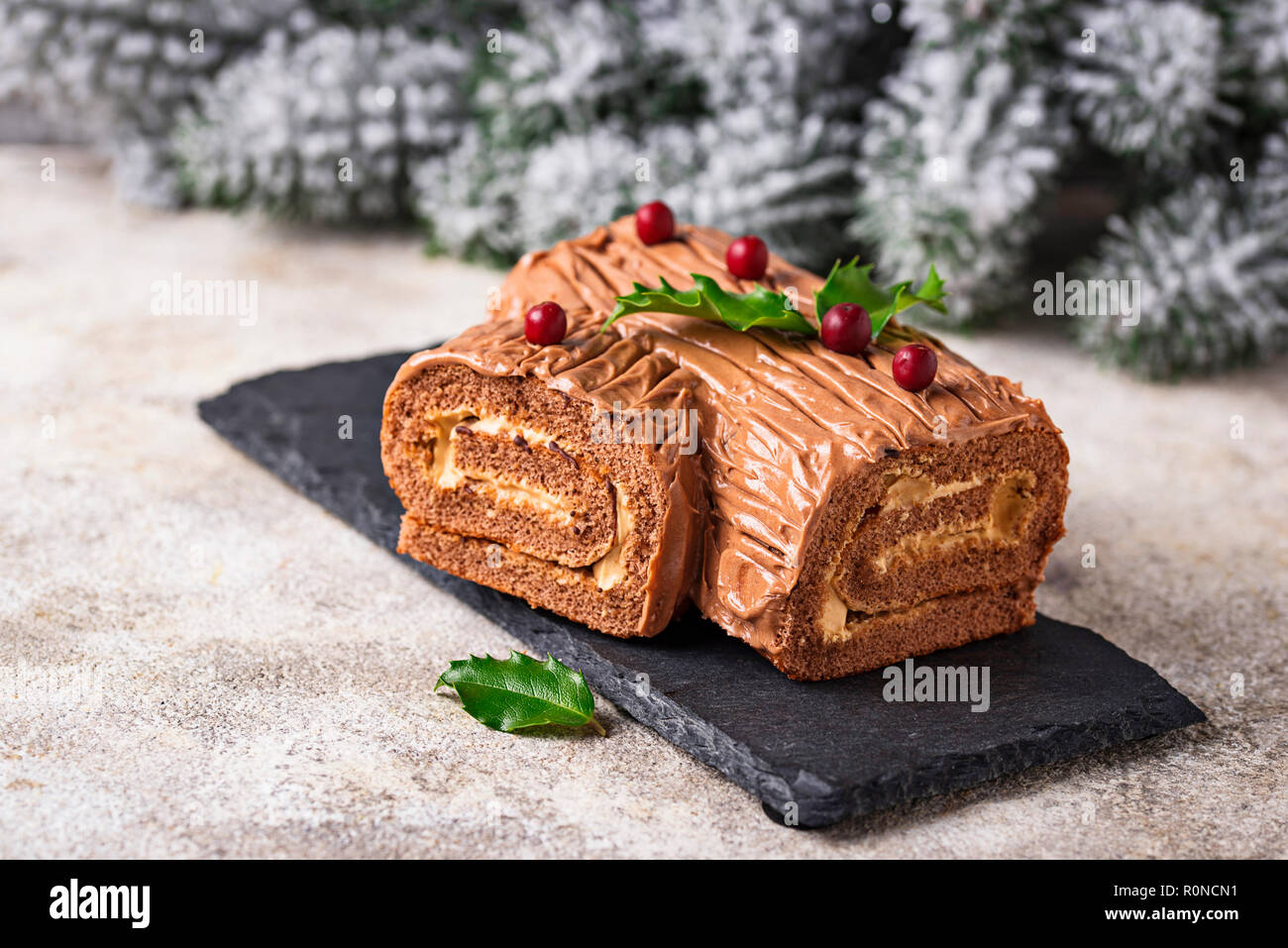 Christmas yule log cake. Traditional chocolate dessert  Stock Photo