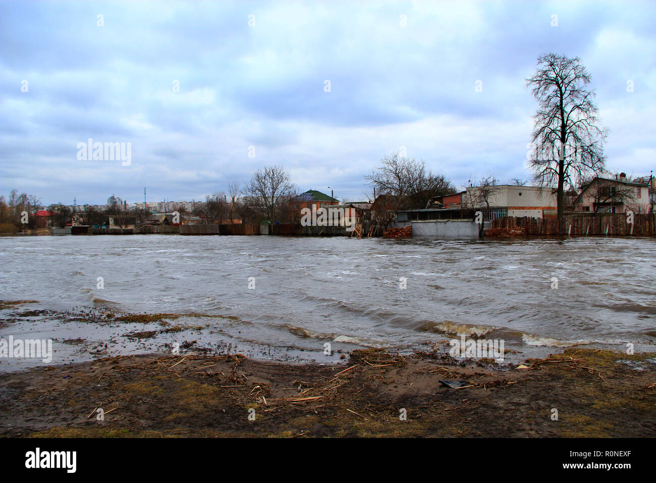 Flooding of river in spring in town during melting of snow. Flooding