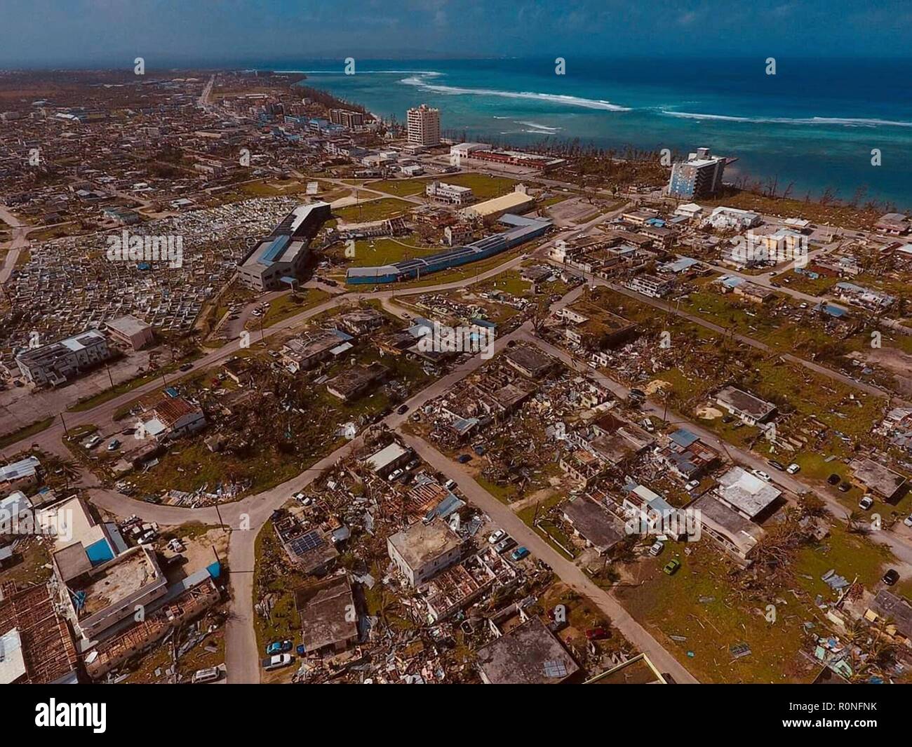An aerial photo showing the southern end of Saipan almost completely destroyed by Super Typhoon Yutu November 4, 2018 in Saipan, Commonwealth of the Northern Mariana Islands. The islands were devastated by Typhoon Yutu on October 28th, the strongest typhoon to impact the Mariana Islands on record. Stock Photo