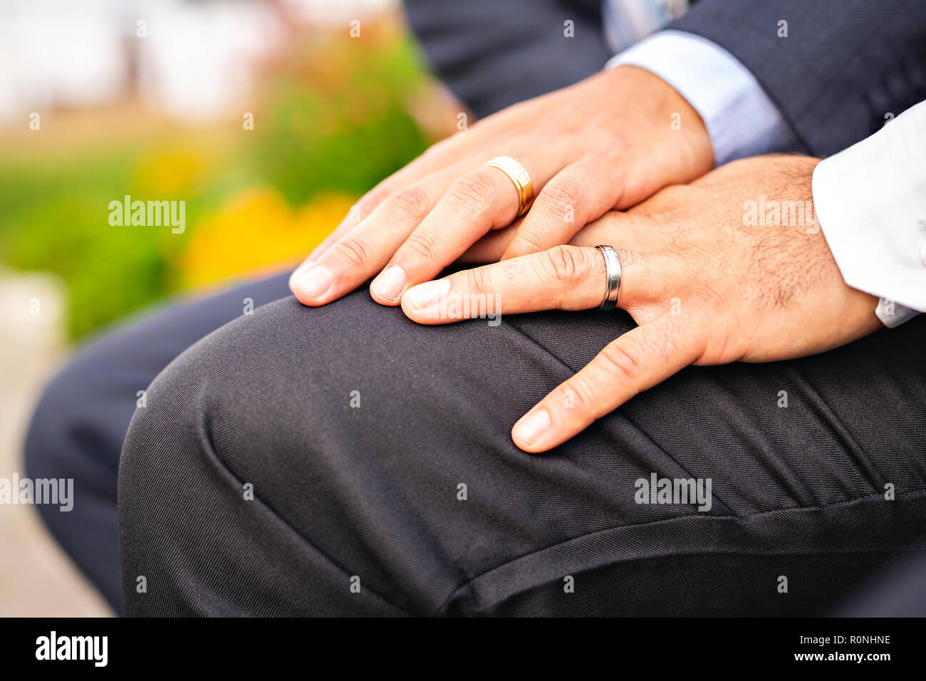 hand with ring of gay couple in the park on their wedding day Stock Photo