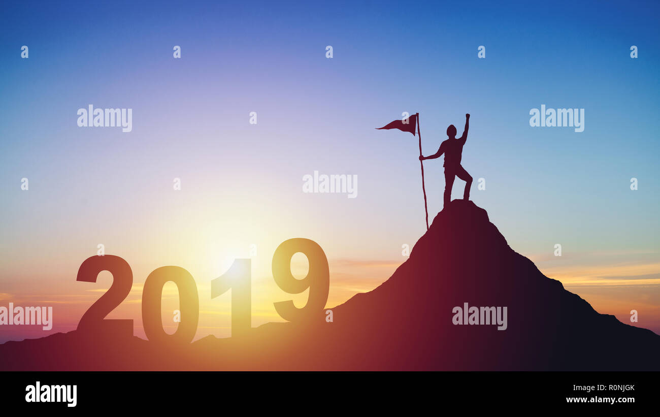 silhouette of man with flag on mountain top over sunset Stock Photo - Alamy