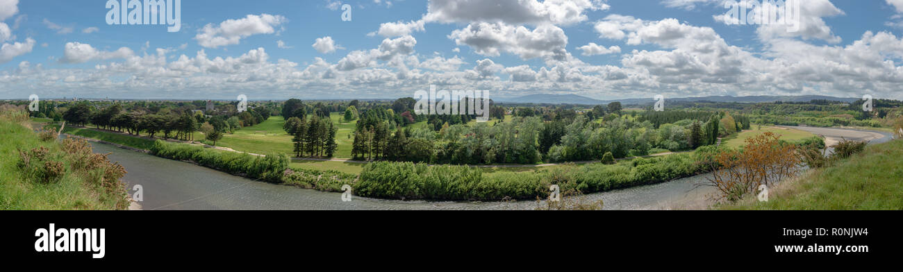 Manawatu river flowing through lush countryside in Palmerston North, New Zealand Stock Photo