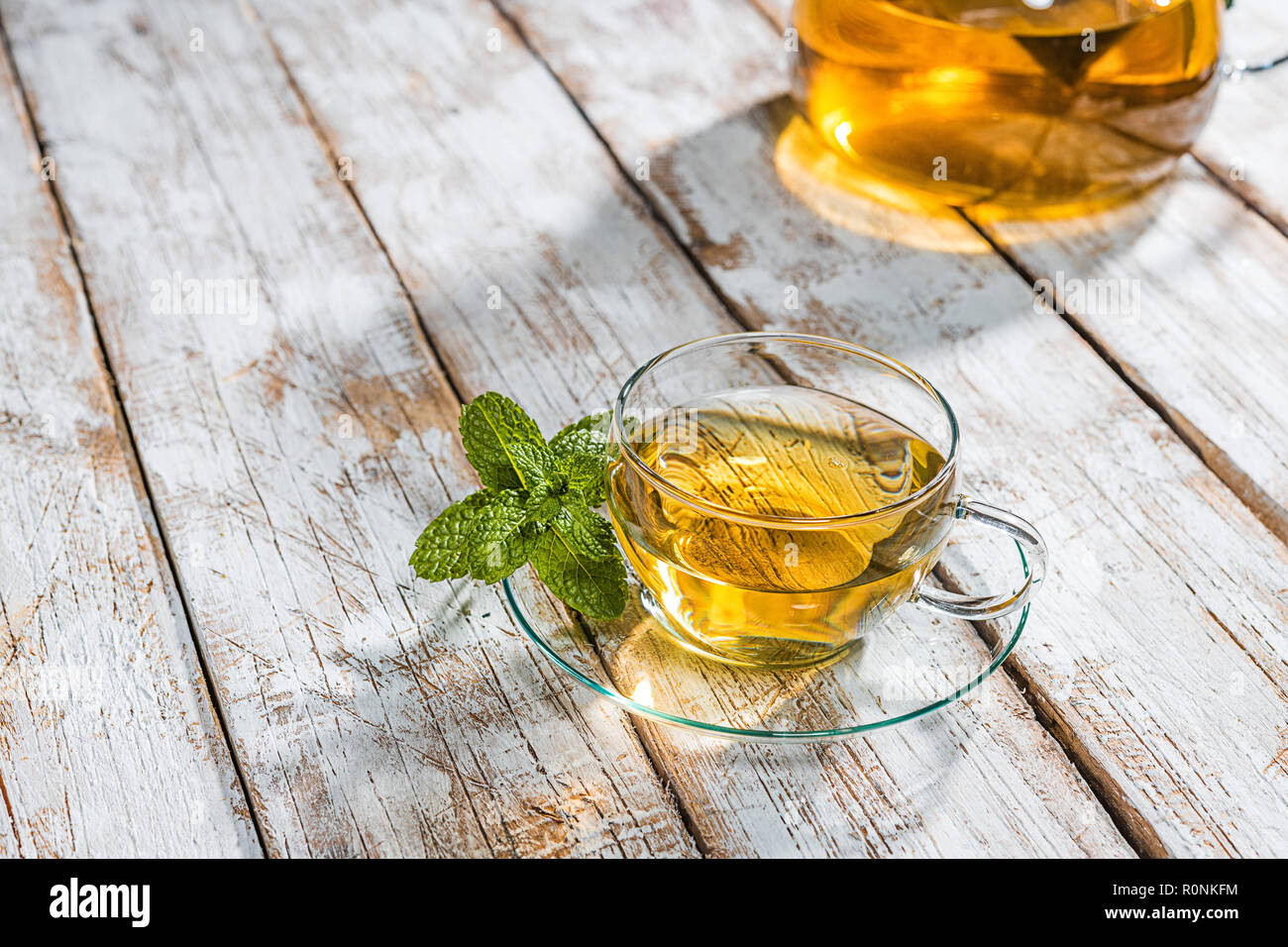 Glass cup with tea on wooden table Stock Photo