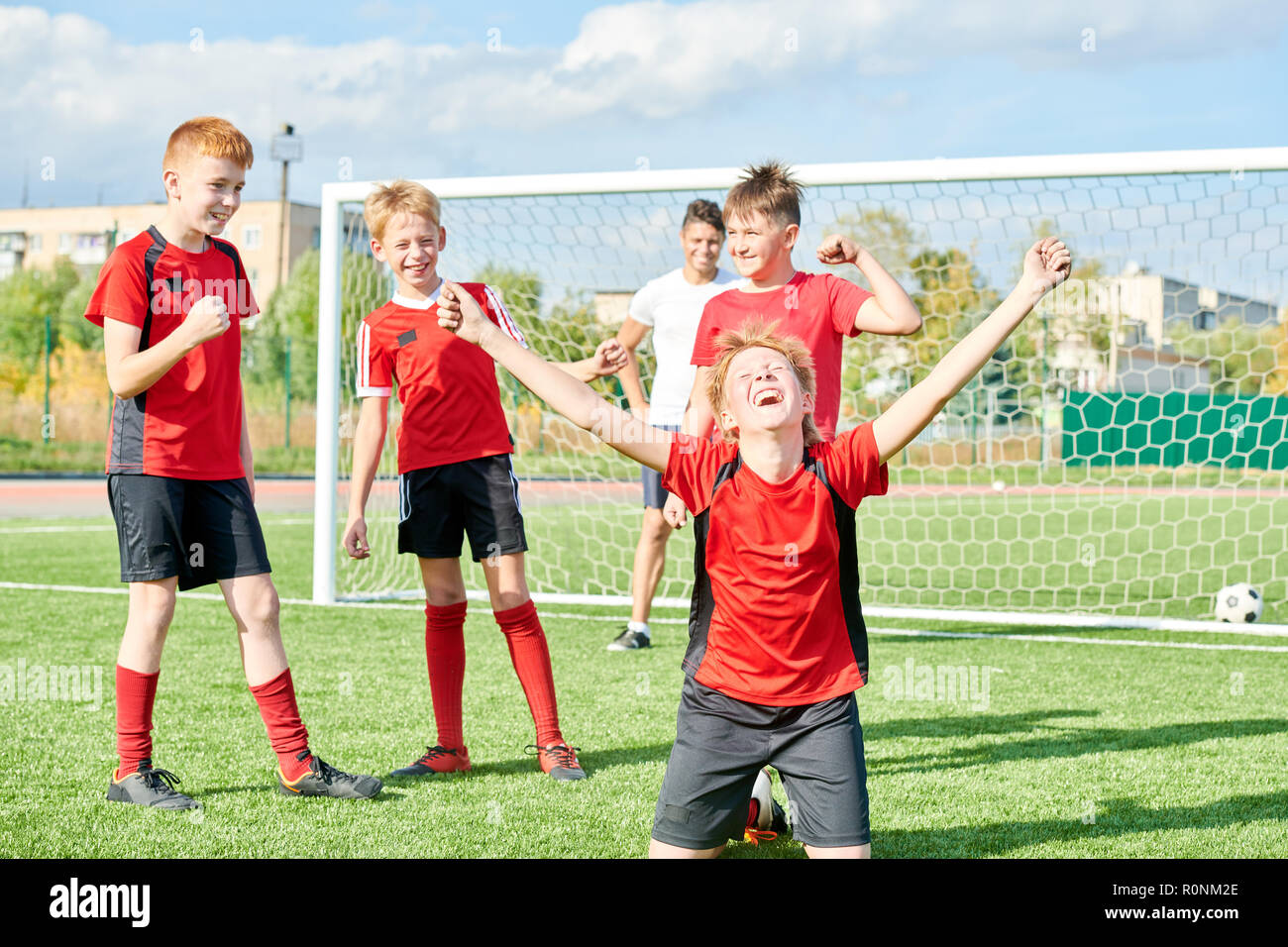 Football Team Celebrating Victory Stock Photo Alamy