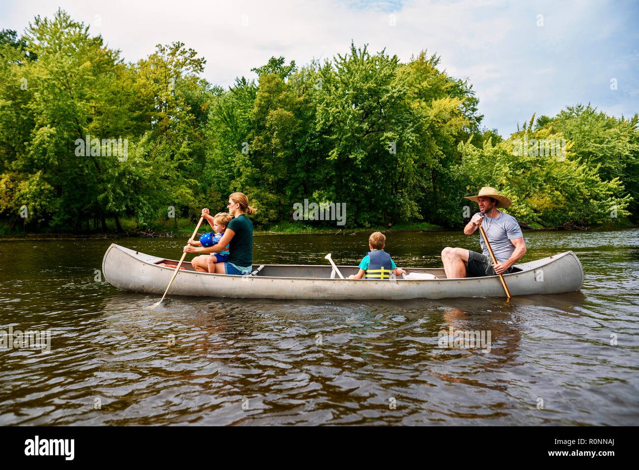 Family with two children canoeing, United States Stock Photo