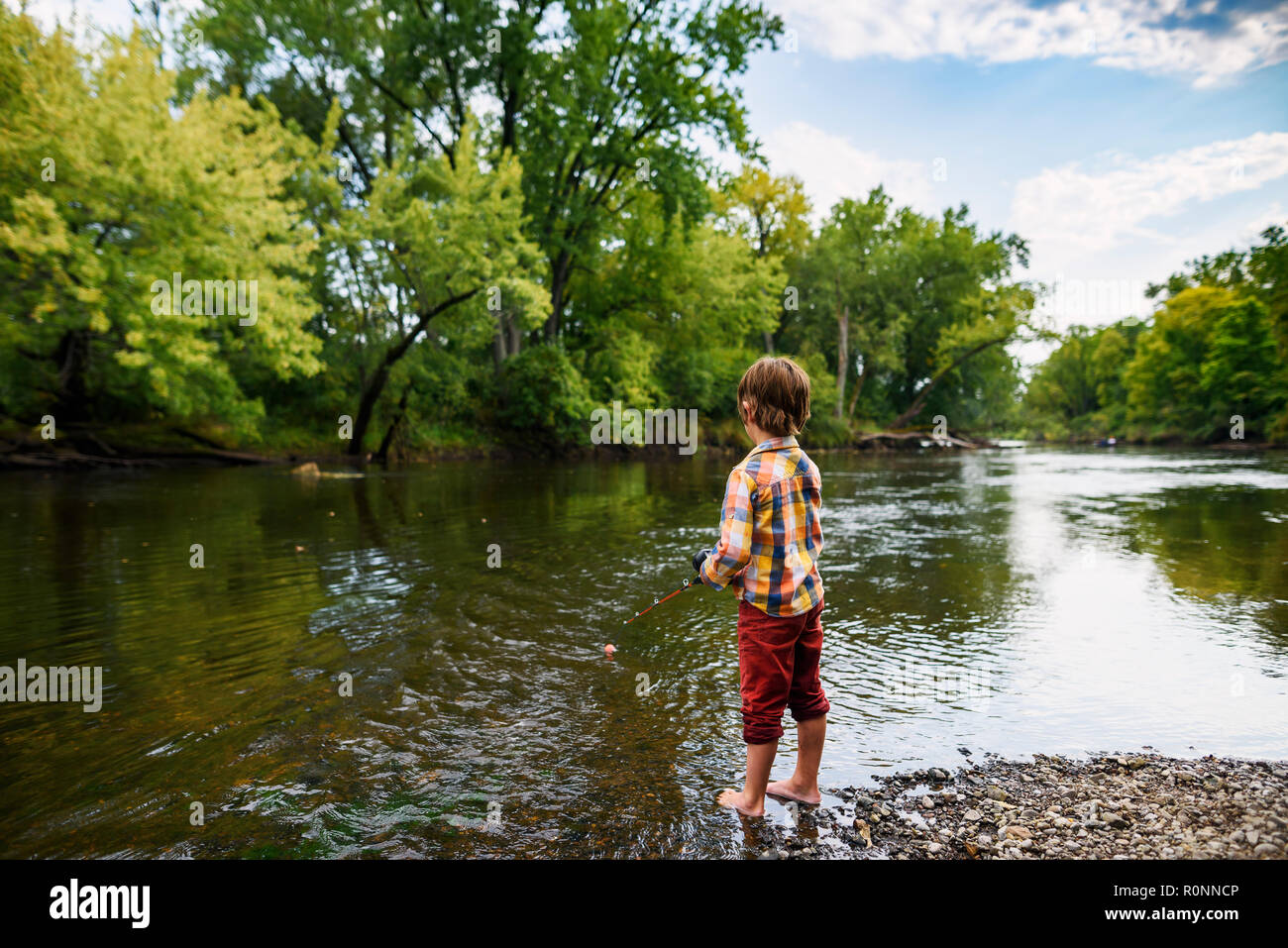 Boy fishing in a river hi-res stock photography and images - Alamy
