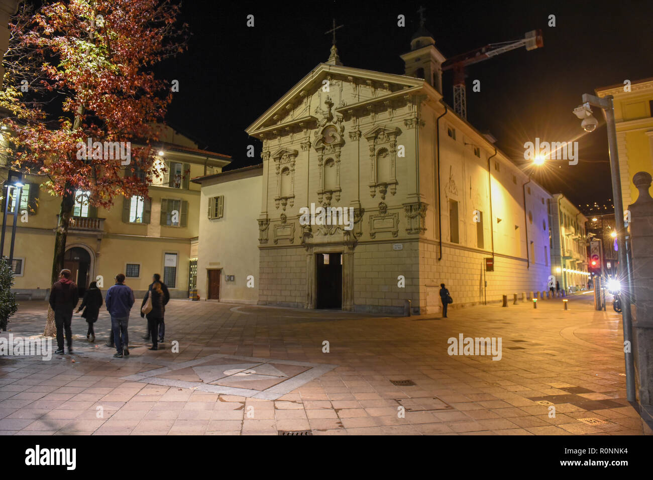 Lugano, Switzerland - 5 March 2016 - people walking in front of St. Rocco church at Lugano in Switzerland Stock Photo