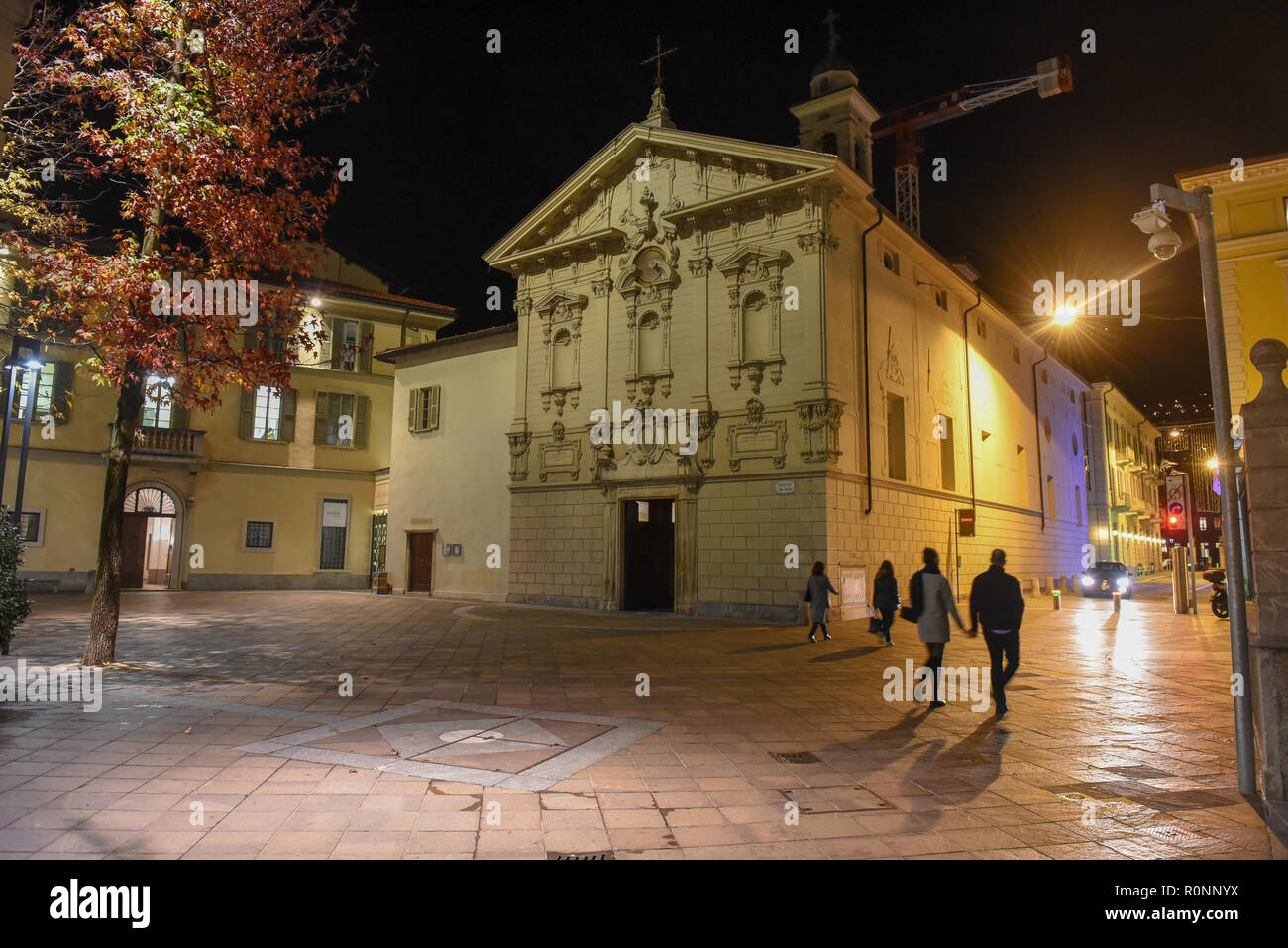 Lugano, Switzerland - 5 March 2016 - people walking in front of St. Rocco church at Lugano in Switzerland Stock Photo